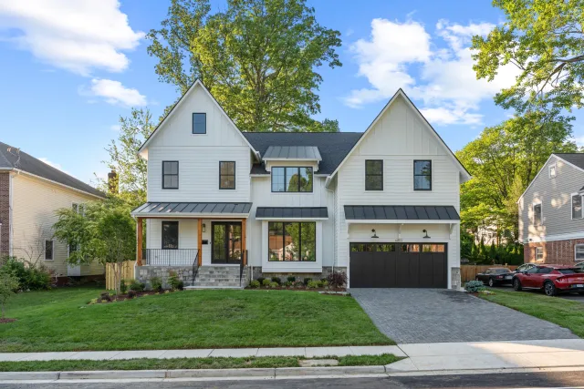 Unbranded curbside front exterior photo of a white modern farmhouse in Arlington VA — the shot BRIGHT MLS requires on every listing