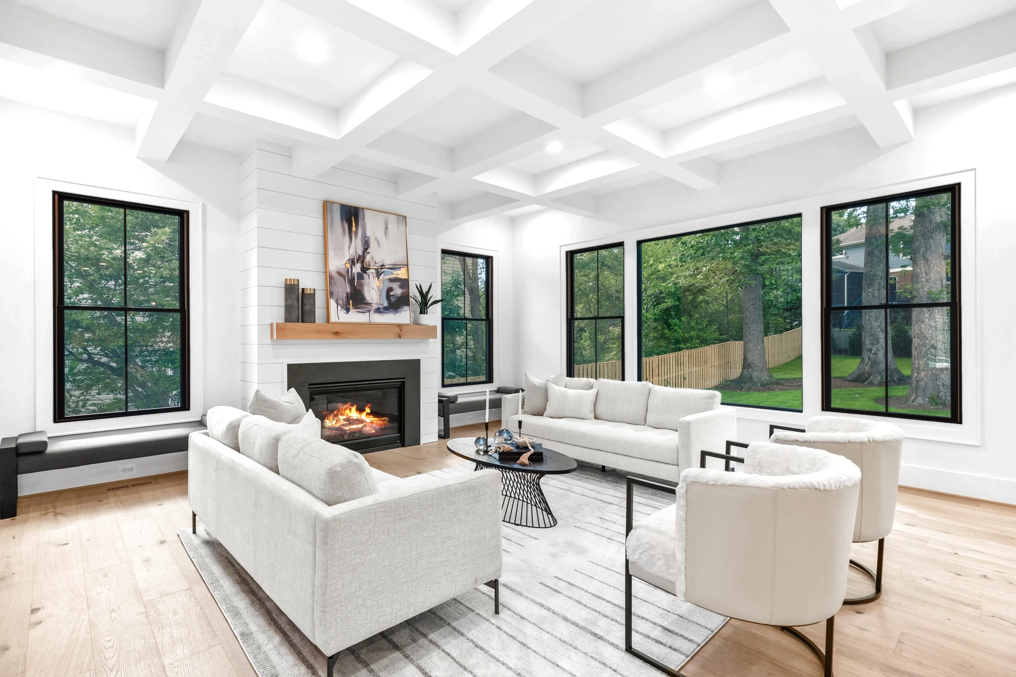 Bright open-concept living room with natural light and hardwood floors — rental listing photography by Umedia