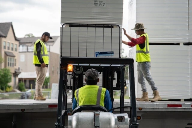 Construction scaffolding photography — workers on commercial building site