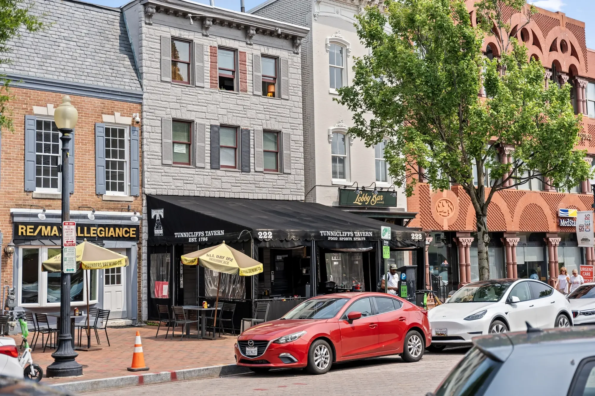 Capitol Hill commercial street in Washington DC with historic rowhouses and sidewalk cafes — neighborhood photography by Umedia