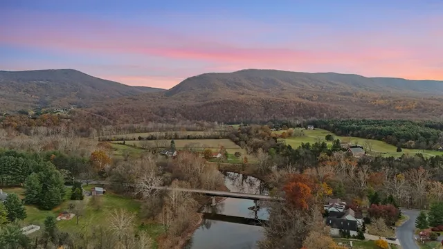 Aerial drone photograph showing a residential property and its surrounding neighborhood