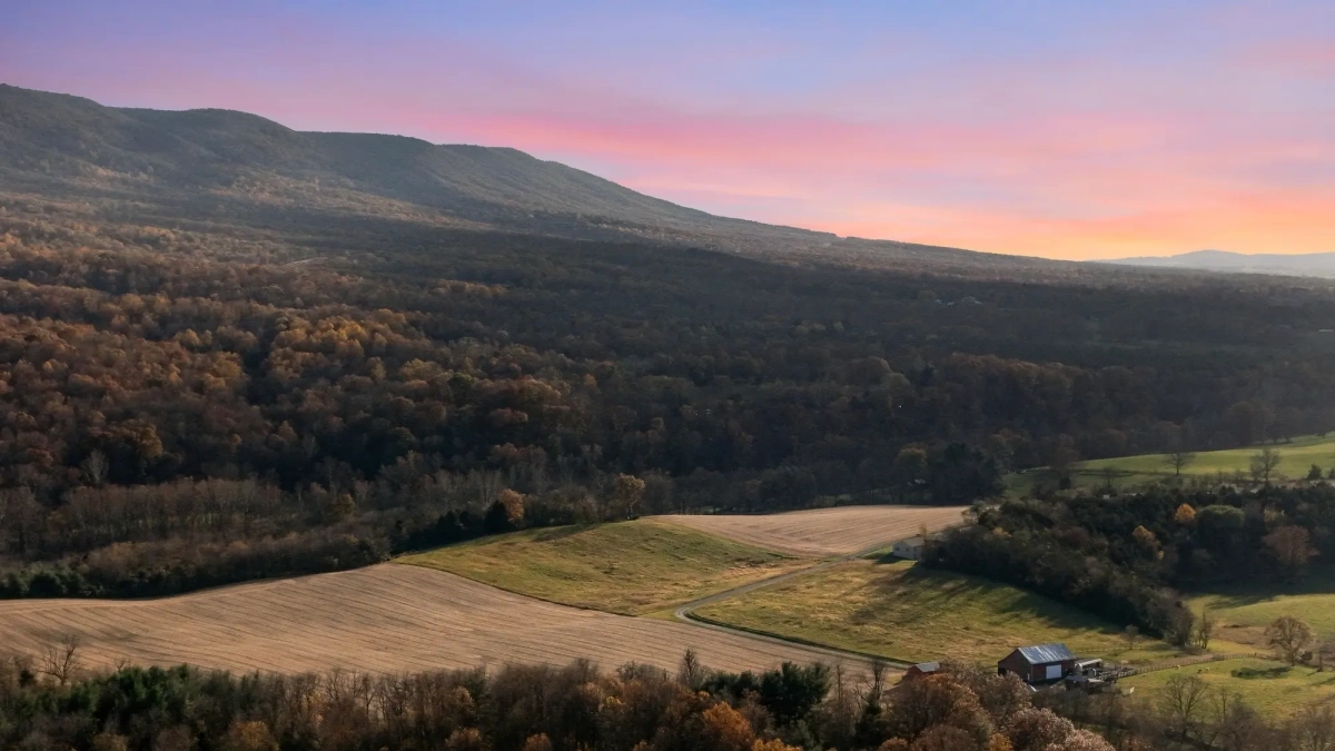 Sweeping valley landscape at sunset from drone