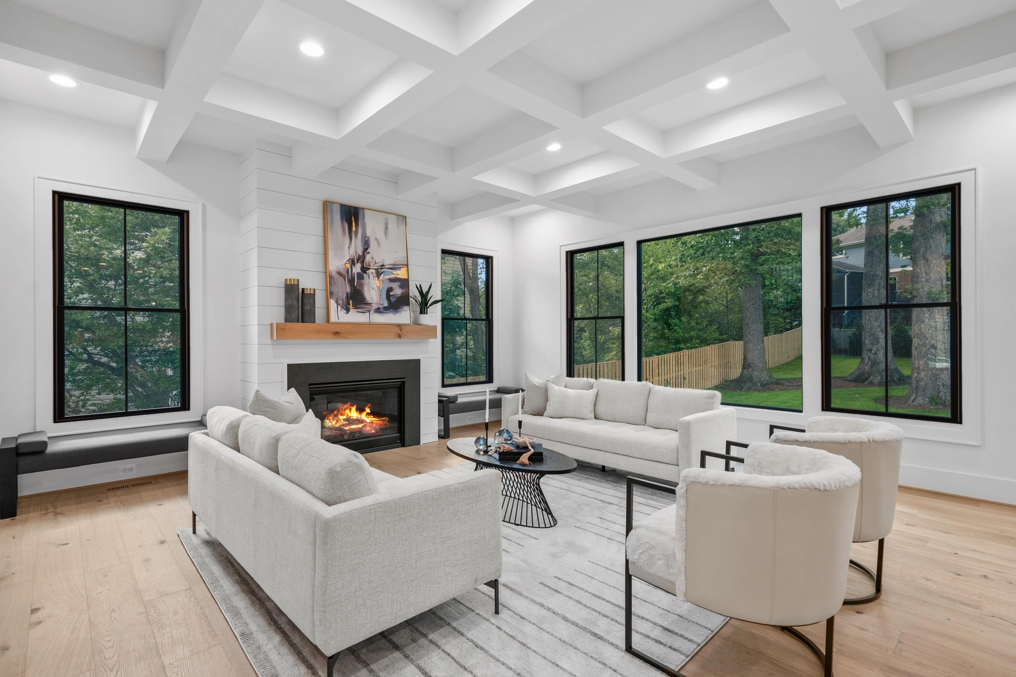 Bright open-concept living room with natural light and hardwood floors