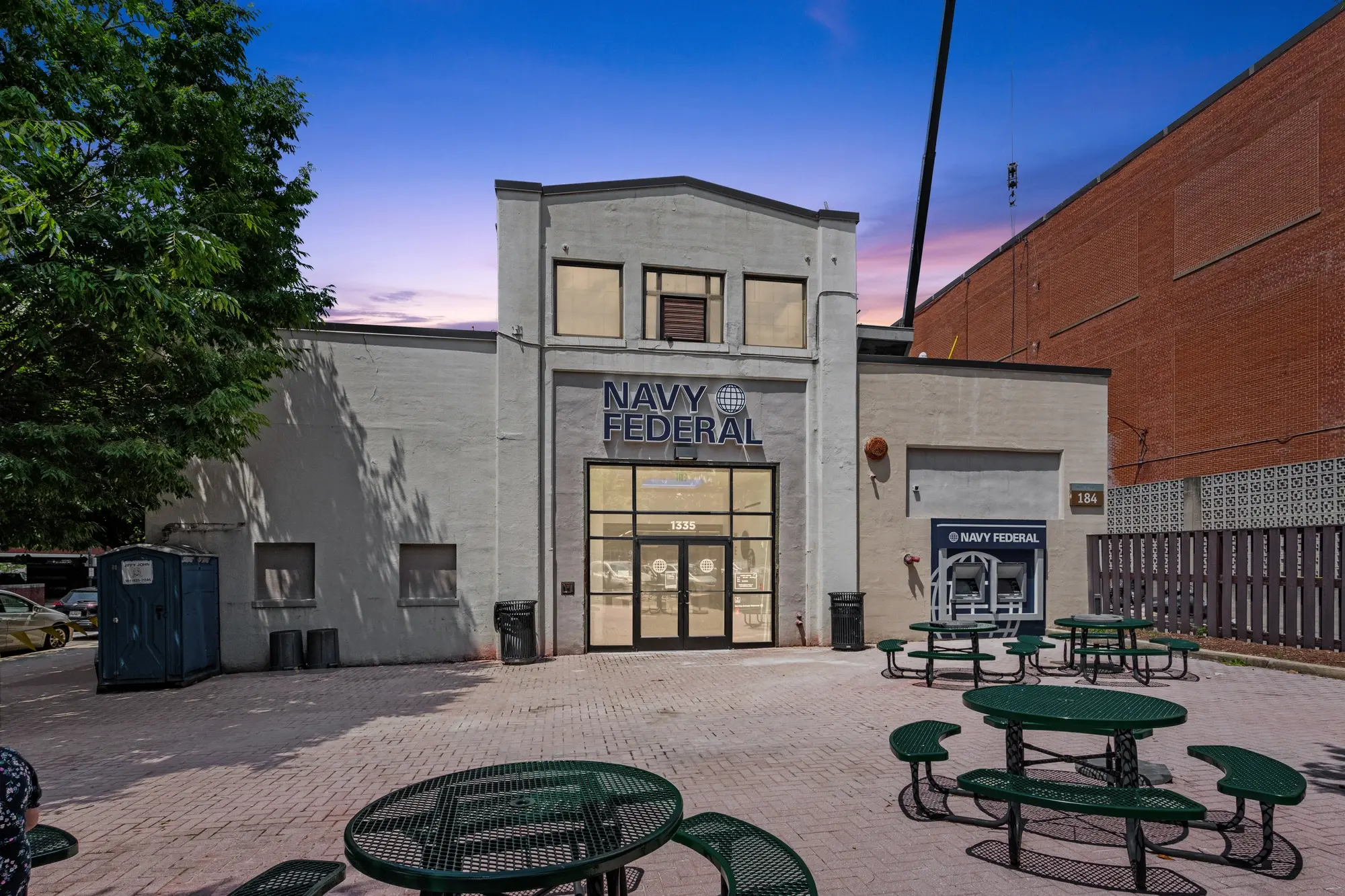 Navy Federal Credit Union branch exterior at twilight with illuminated signage in Washington DC